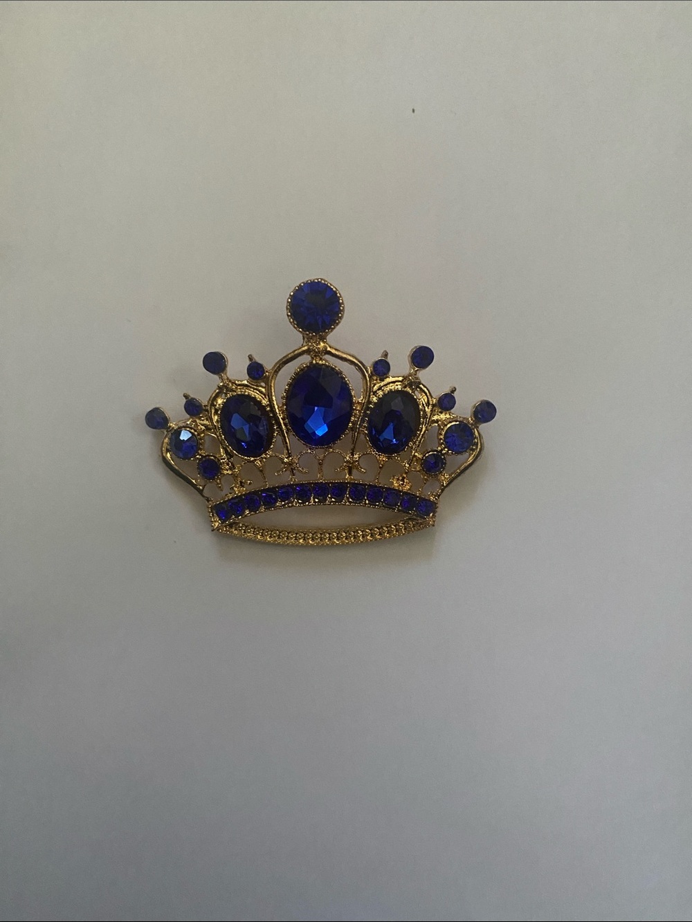 Gold-Tone Crown Brooch with Deep Blue Stones